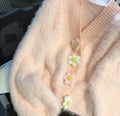 Pink fuzzy cardigan with pastel floral buttons for women