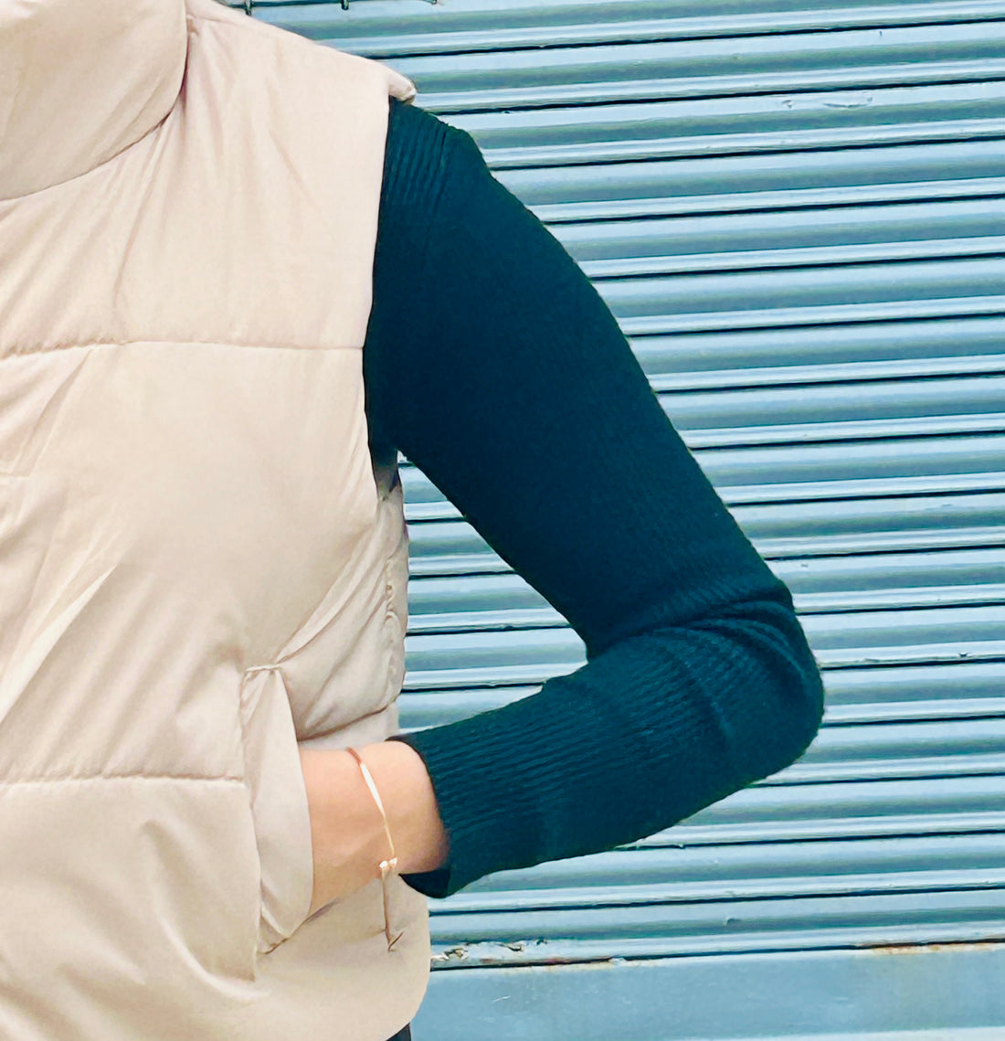 Beige sleeveless puffer Jacket for women - lightweight and stylish outerwear.